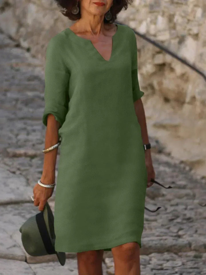 Elegant V-ringad draped midi klänning